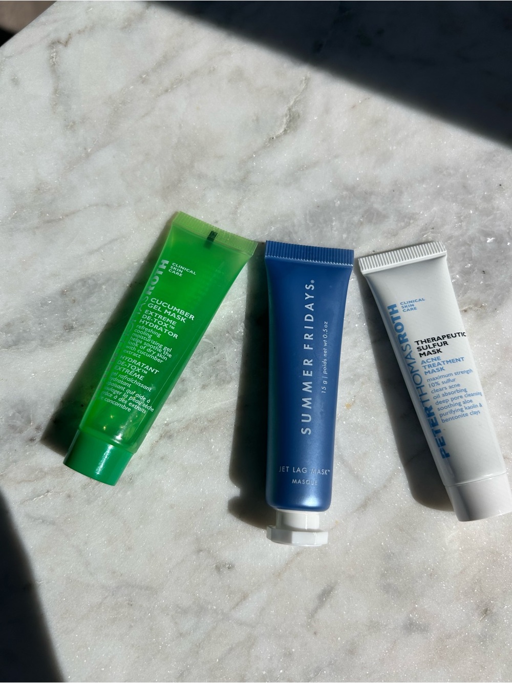 Summer Fridays Jet Lag Mask and Peter Thomas Roth face mask, travel size